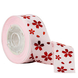 Flor vermelha do ouro da folha na fita impressa rosa do Grosgrain para a decoração do feriado